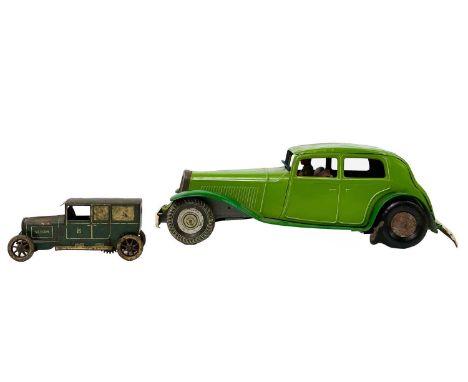 Tin plate cars - Lehmann 765 Sedan and one other A Lehmann clockwork 765 Sedan, some paintloss and rust. A large scale green 