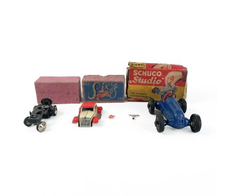 German Boxed Model Cars - Schuco & D.R.P.  Comprising:A "Six" DRP boxed Red & Cream Saloon Car - only one headlight present. 