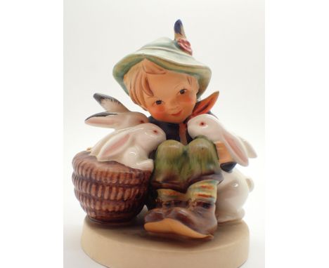 Hummel figurine of boy with rabbits
