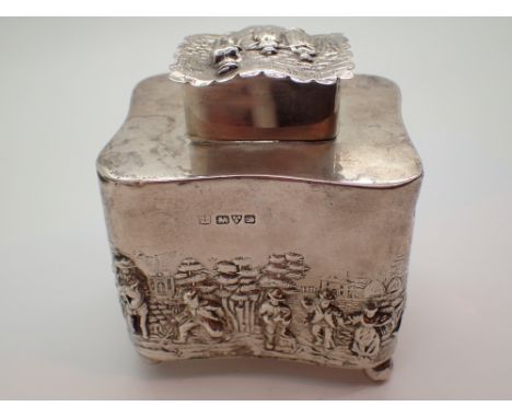 Hallmarked silver tea caddy relief decorated with figural scenes to the body and cover assay Chester