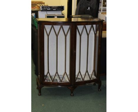 20th Century cabinet with astragal glazed doors, opening to reveal a single shelf, standing on cabriole legs, 93cm wide