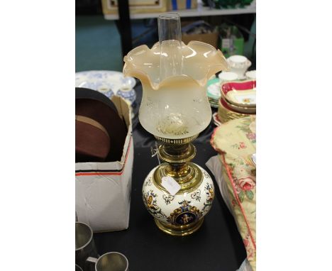 20th Century oil lamp with ceramic reservoir, brass pedestal and base, with an etched glass shade, marked NB to the base, 55c