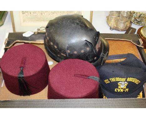 Miners helmet, together with two fez's a USS Theodore Roosevelt cap, together with  three books