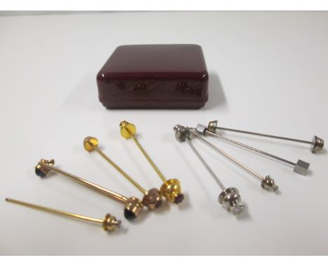 8 x Tie Pins. 1 x 9k Gold (375) 3 x Gold Coloured & 4 x Silver Colour. Set with Diamonds, Red & Blue Stones (As Viewed).