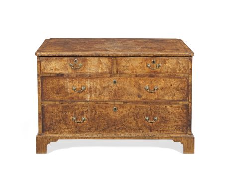 An early 18th Century and later Walnut ChestThe associated rectangular quarter veneered feather-banded and crossbanded top wi