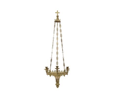 A gothic revival six-light brass chandelierFrench, circa 1890With octagonal candle sconces, hung with later coloured glass dr