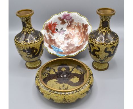 A Chinese cloisonne garniture, comprising a shallow bowl and a pair of baluster vases decorated with five claw dragons, palma