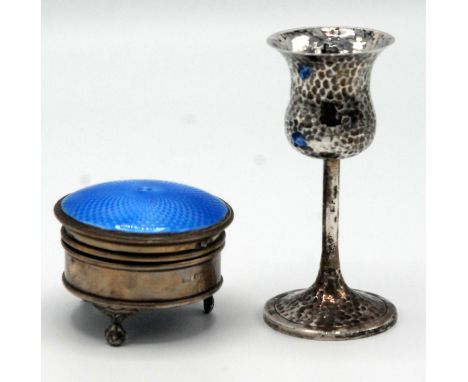A blue enamelled small silver jewel box on three ball and claw feet, together with a hammered small goblet with thistle bowl.