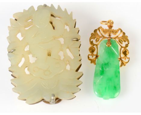 A carved jade pendant set in very high purity gold, pierced mount, together with one other jade piece. 