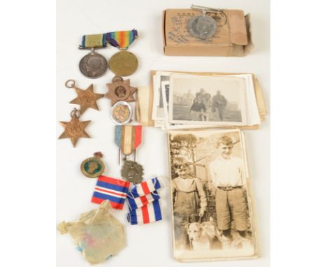 A WWI pair of medals to driver H. Teague Royal Artillery, together with WWII pair with box and papers to Pte J.M. Teague, a F