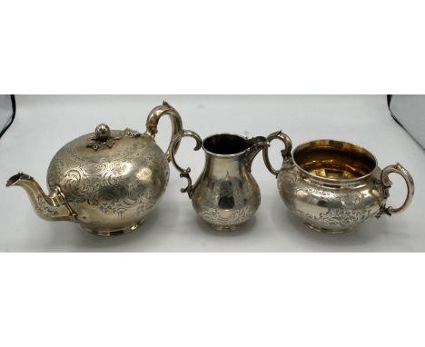 A good Victorian Barnard three piece silver tea service, the pot with melon finial, each piece with floral and 'C' scroll dec