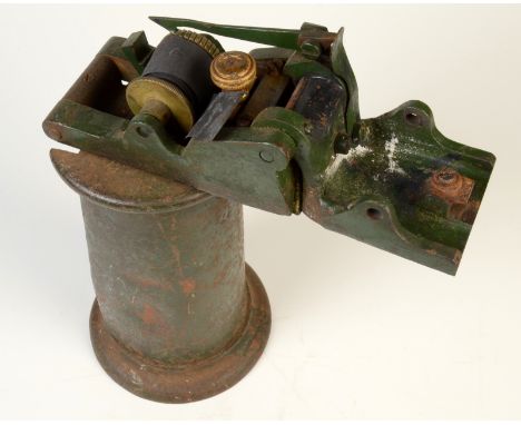 A cast iron railway ticket stamp machine, circa 1920s, metal plaque to top inscribed A1055, height 25cm.