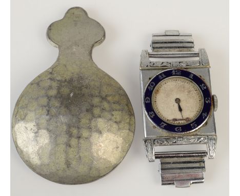 A pewter caddy spoon by Hugh Wallace and a pre war gentleman's wristwatch with enamelled chapter ring.