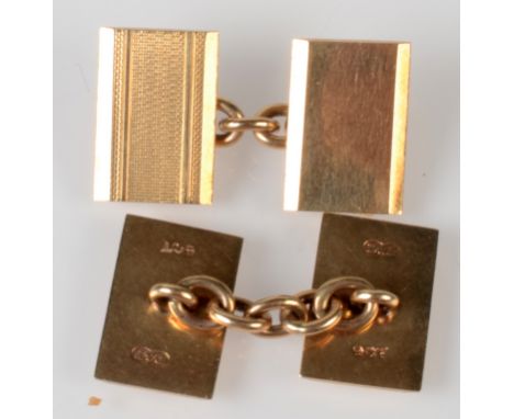 A pair of engine turned 9ct. gold cufflinks, 7g.