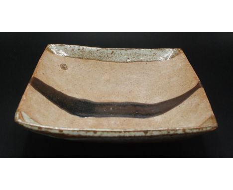 Janet Leach, St Ives Pottery, a square bowl with a trail of tenmoku glaze, impressed JL and St Ives marks, 21 x 20cm.