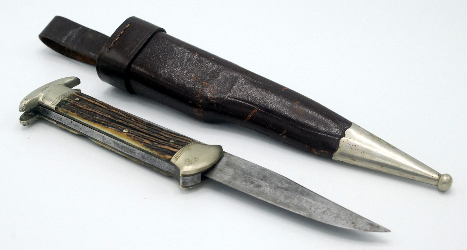 A folding sheath knife by Hugo Koller, Germany, with clipped back long