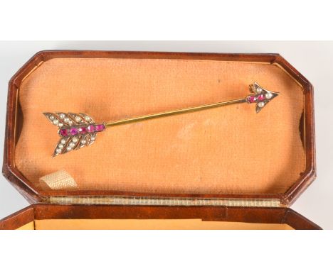 A 15ct. gold arrow brooch, set rubies and pearls.