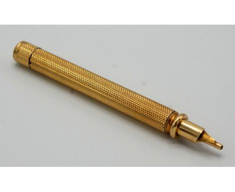A high purity gold, engine turned propelling pen/pencil by S. Mordan & Co. 