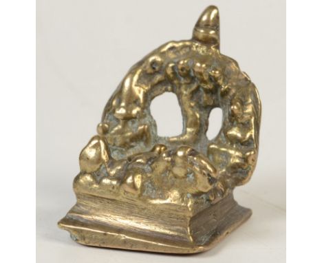 A miniature brass votive group with oil lamp and tree, width 3.25cm, height 4cm.