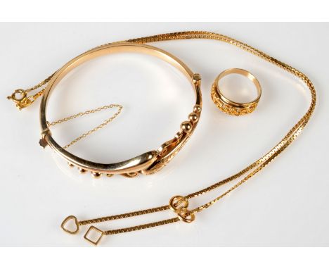A 9ct. gold hinged bangle, a 9ct. gold necklace, 15.4g, together with a gold ring. 