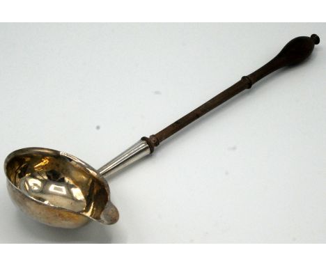 A silver George III punch ladle with turned wood handle. 