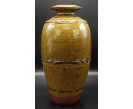 A tall ovoid vase by Richard Batterham with flanged neck olive green glaze, height 36cm.   Condition report:  Tiny area of cr