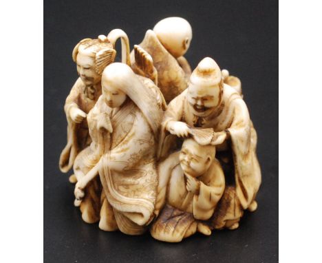 A Japanese ivory netsuke carved as a group of figures representing the six famous poets (Rokkasen), three nobles, two priests