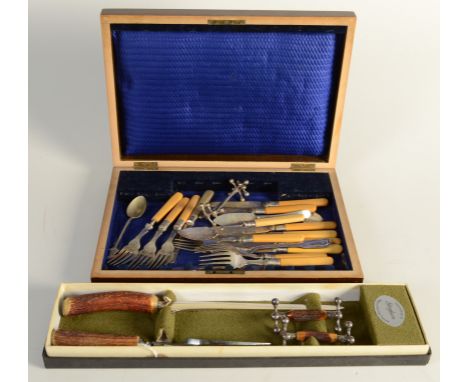 A Staghorn carving knife and fork and a pair of similar knife rests, etc.