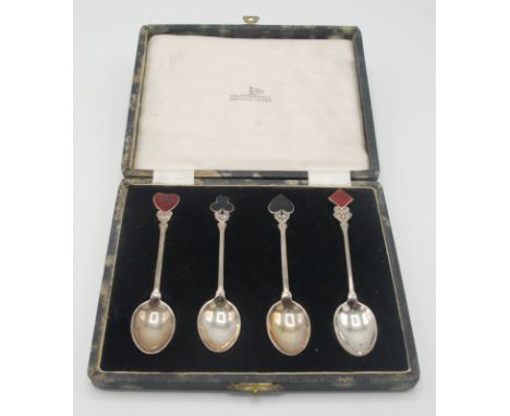 A set of four silver bridge coffee spoons by Walker & Hall, each with an enamel card suit terminal, Birmingham 1949, cased.  