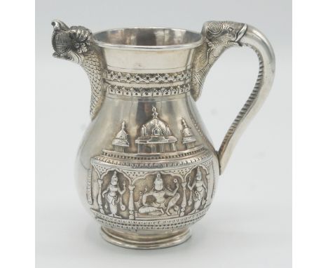 An Indian Bangalore silver bellied cream jug by C Krishniah Chetty & Sons, the handle an elephant's head and trunk, the spout