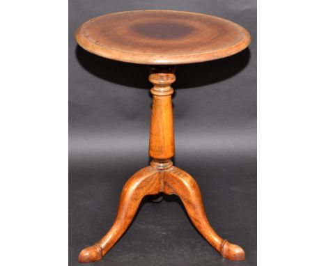 A tripod occasional table.