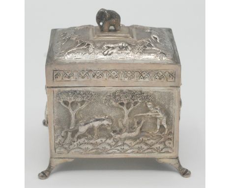 An Indian silver tea caddy of rectangular section portraying tigers and elephants, maximum width 10.5cm, 200g.