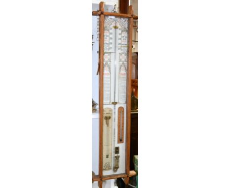 A late 19th century Admiral Fitzroy barometer with storm glass and thermometer, in an oak case, 104 x 27cm.