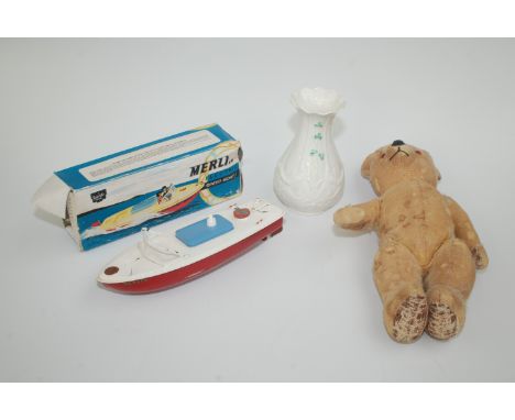 A Sutcliffe model electric speed boat, original box, together with a musical Chad Valley teddy bear (not working) and a moder