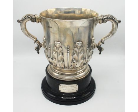 A very large and impressive late Victorian silver cup in early 18th century style, the bell shaped bowl embossed with leaves,