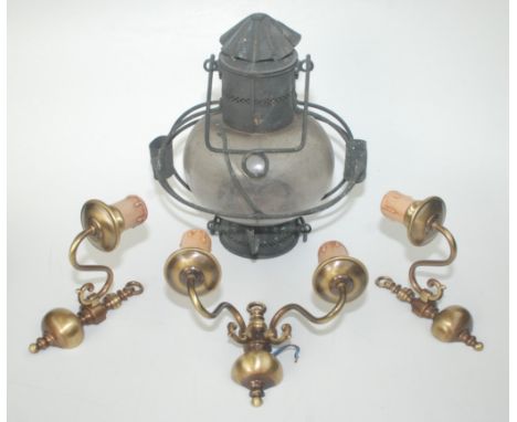 A ship's brass companionway lamp with its original glass shade and paraffin burner, height exluding suspension handle 34cm, t
