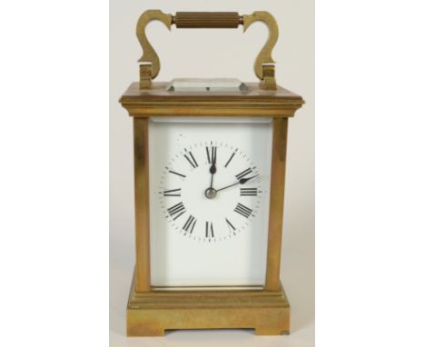 A French brass carriage clock with Roman numerals, height excluding handle 13.5cm.    Condition report:  It chimes. Very smal