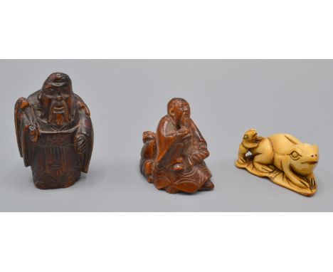 Three Japanese netsukes, the first wooden, a seated, bearded immortal drinking from a cup, his servant with gourd behind him,