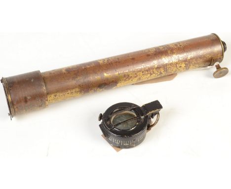 A T.G. Co. Ltd London 1942 MK III military marching compass no.177655 and a brass cased telescope,  33.5cm.