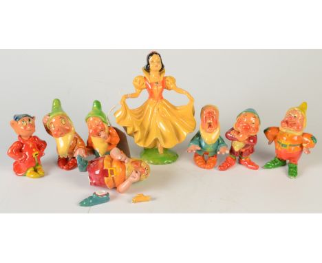 An early set of Wade 'Snow White and The Seven Dwarfs', printed marks to base of each piece, Snow White height 16.5cm. 