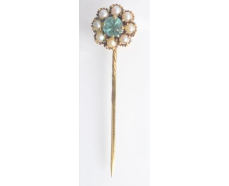 A gold pin the cluster finial with central green stone surrounded by pearls, boxed. 