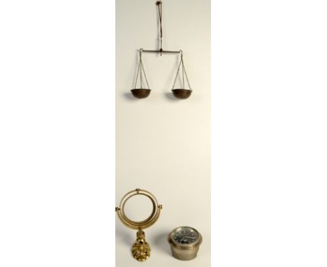 A Bentley car clock and a brass gimbal bracket and a balance.