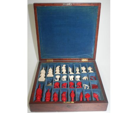 A fine 19th century English ivory chess set of John Barleycorn type, natural and stained red, maximum height 14.3cm, pawn hei