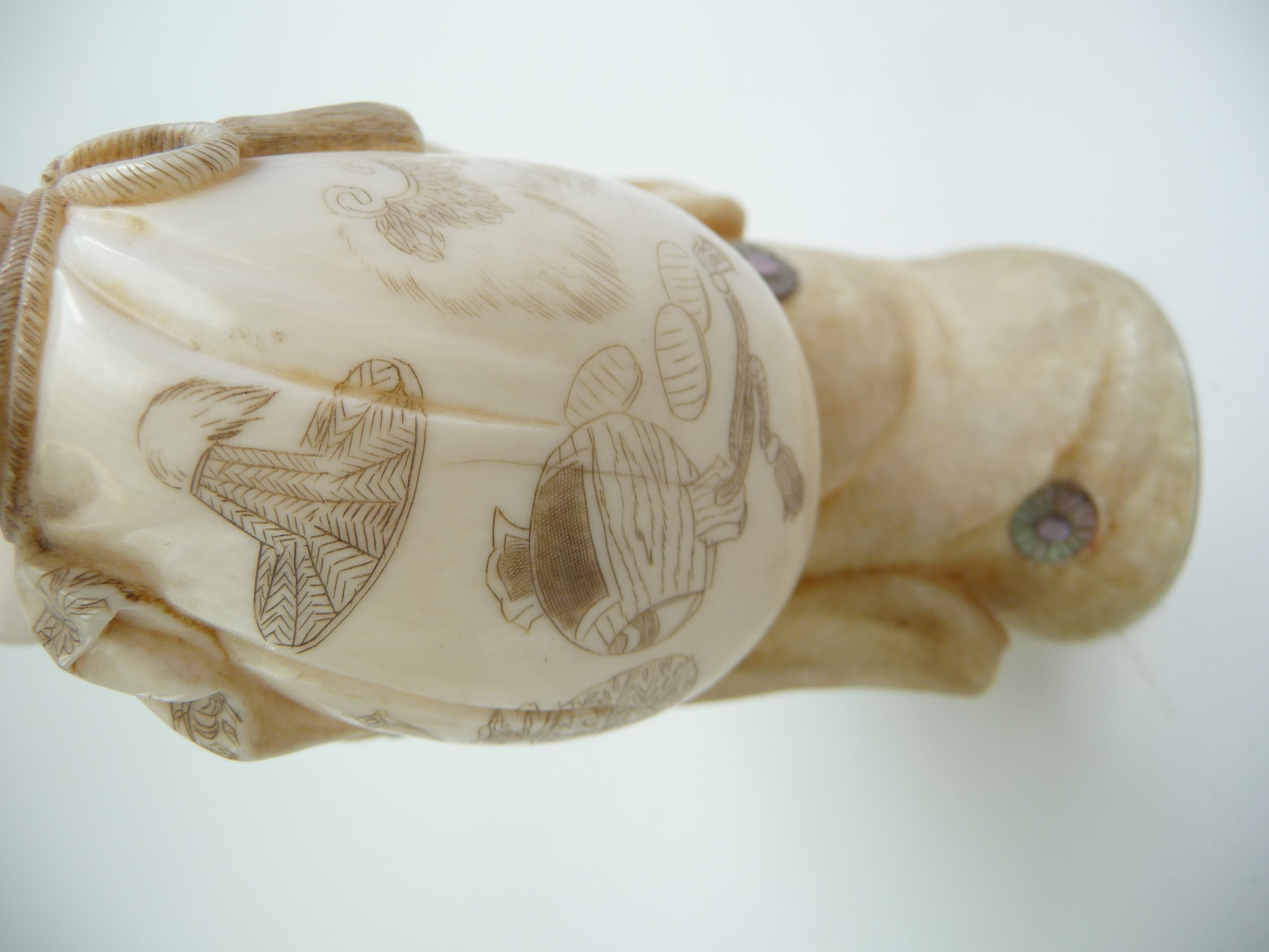 A Japanese Ivory Okimono Of Hotei The God Of Contentment And Happiness One Of The Seven Gods Of