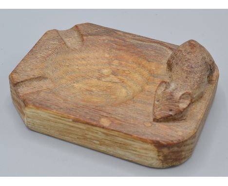 A Robert Mouseman Thompson oak ashtray carved with a mouse, 10cm.