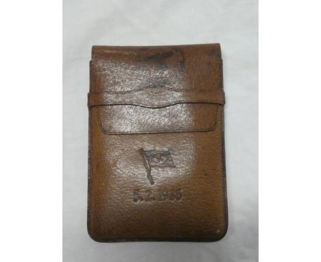 A German Nazi related leather wallet/cigar case with eagle and swastika markings and maritime flag "K" dated 5/2/1935
