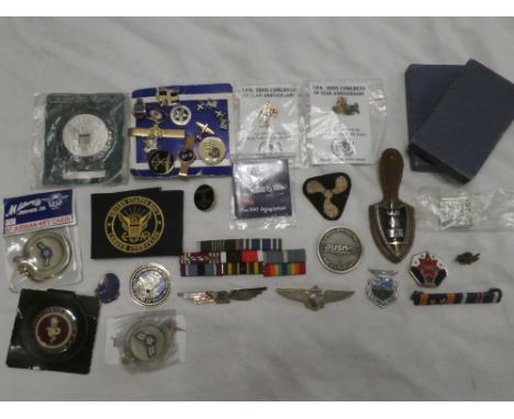 A selection of various American badges and insignia including sterling silver United States Navy wings; NYPD United States Na