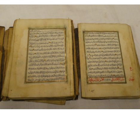 An Antique Arabic Manuscript Koran, disbound, 5½" x 4", 15 lines to a a plate in black ink and gold borders in Morocco pocket