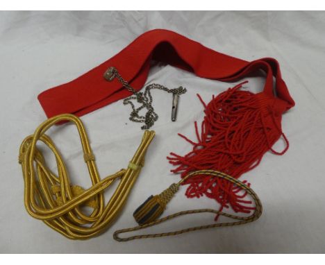 An Officer's red sash with attached whistle with gilt cord agilettes and a sword knot