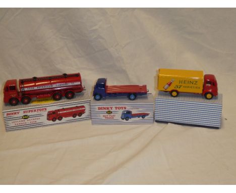 Three modern mint and boxed Dinky vehicles including 943 Leyland Octopus tanker, 512 Guy flat truck and 920 Heinz Guy deliver